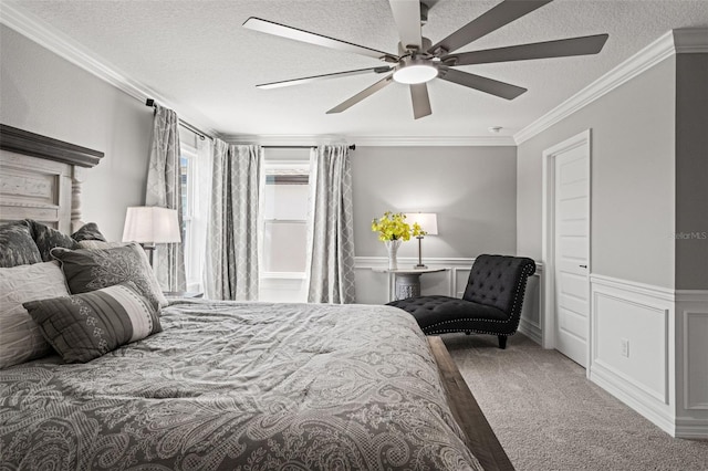 7819 Notched Pine Bnd, Wesley Chapel, FL 33545 - bedroom with carpet flooring, a textured ceiling, crown molding, a wainscoted wall, and ceiling fan