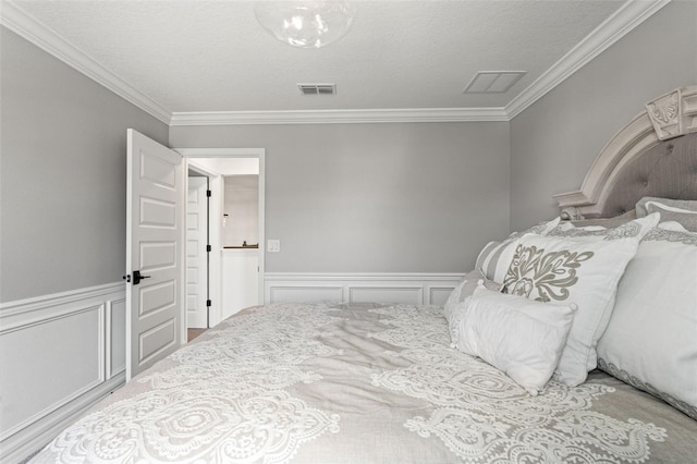 7819 Notched Pine Bnd, Wesley Chapel, FL 33545 - bedroom with crown molding, a decorative wall, and wainscoting