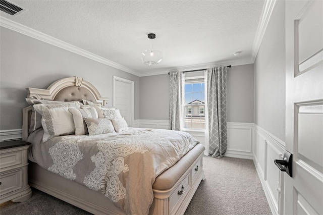 7819 Notched Pine Bnd, Wesley Chapel, FL 33545 - carpeted bedroom featuring ornamental molding, a textured ceiling, and a wainscoted wall