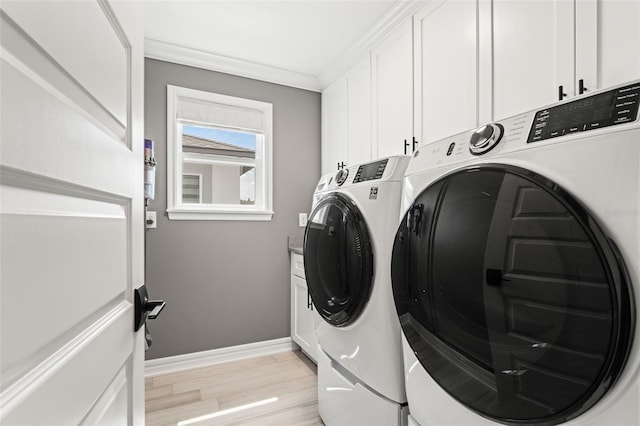 7819 Notched Pine Bnd, Wesley Chapel, FL 33545 - laundry area with independent washer and dryer, cabinet space, light wood finished floors, and crown molding