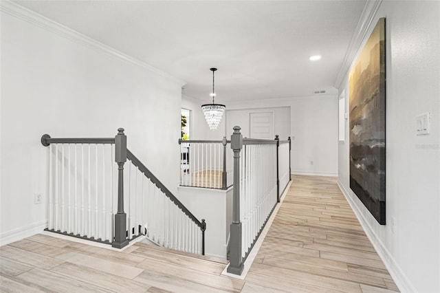 7819 Notched Pine Bnd, Wesley Chapel, FL 33545 - corridor featuring an upstairs landing, wood finished floors, a chandelier, ornamental molding, and recessed lighting