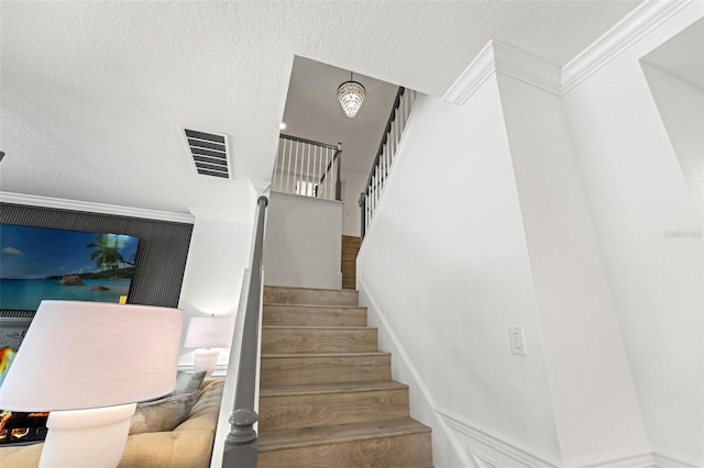 7819 Notched Pine Bnd, Wesley Chapel, FL 33545 - staircase with ornamental molding