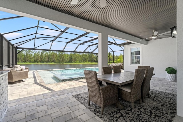 7819 Notched Pine Bnd, Wesley Chapel, FL 33545 - view of patio with ceiling fan, a water view, glass enclosure, and a pool with connected hot tub