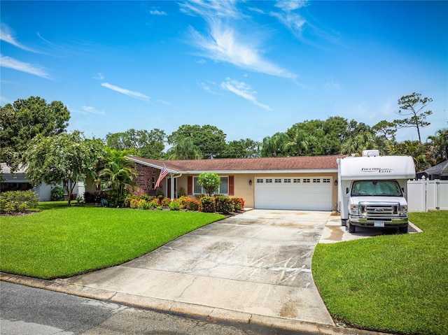 1132 Gershwin Dr, Largo, FL 33771 - ranch-style house with an attached garage, concrete driveway, and stucco siding