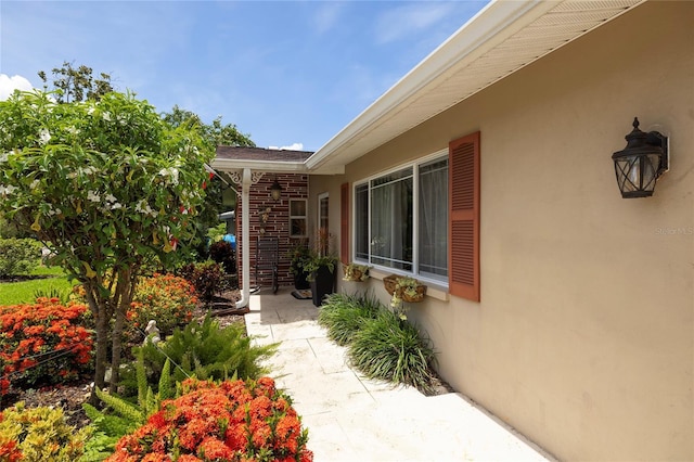 1132 Gershwin Dr, Largo, FL 33771 - view of exterior entry with stucco siding