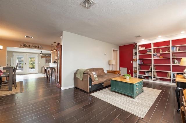 1132 Gershwin Dr, Largo, FL 33771 - living room featuring dark wood finished floors, a textured ceiling, and recessed lighting