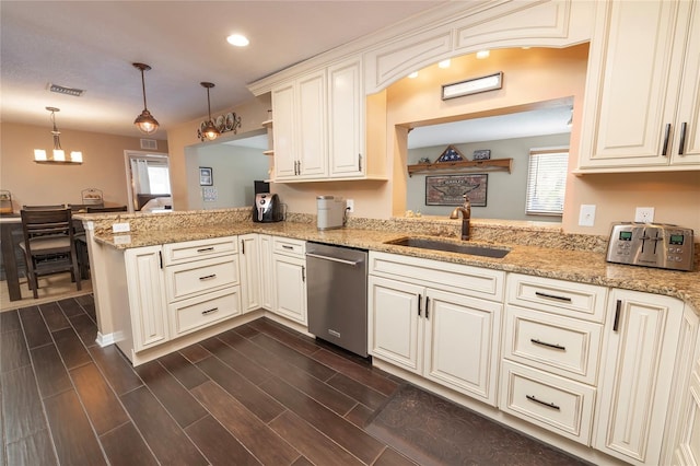 1132 Gershwin Dr, Largo, FL 33771 - kitchen with stainless steel dishwasher, a peninsula, recessed lighting, pendant lighting, and dark wood-style floors