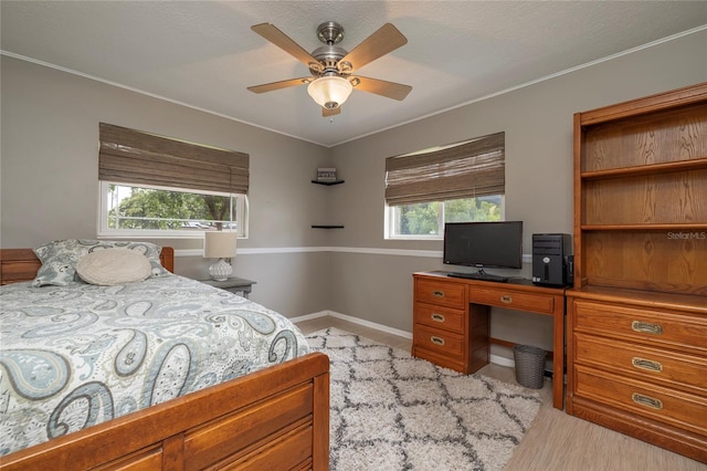 1132 Gershwin Dr, Largo, FL 33771 - bedroom featuring an office area, crown molding, and a ceiling fan