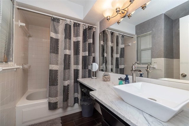 1132 Gershwin Dr, Largo, FL 33771 - bathroom featuring shower / bath combination with curtain, tile walls, and vanity