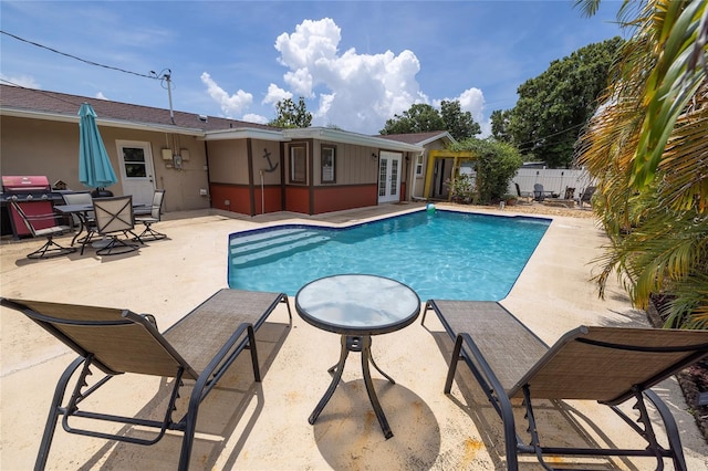 1132 Gershwin Dr, Largo, FL 33771 - view of swimming pool with french doors and a patio area