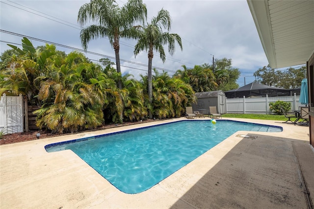 1132 Gershwin Dr, Largo, FL 33771 - view of swimming pool with a storage shed, a patio area, and a fenced backyard