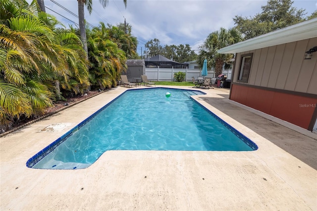 1132 Gershwin Dr, Largo, FL 33771 - view of pool with a patio area, a storage shed, and a fenced backyard