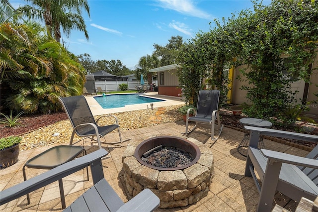 1132 Gershwin Dr, Largo, FL 33771 - view of swimming pool featuring an outdoor fire pit, a patio area, and a fenced backyard