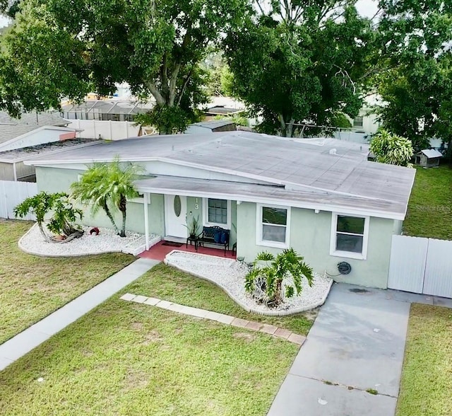 2813 W Kenmore Ave, Tampa, FL 33614 - back of property with stucco siding and covered porch