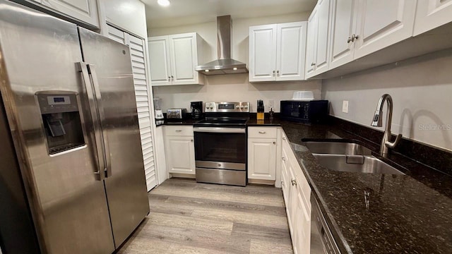 2813 W Kenmore Ave, Tampa, FL 33614 - kitchen featuring stainless steel appliances, wall chimney exhaust hood, white cabinetry, and recessed lighting