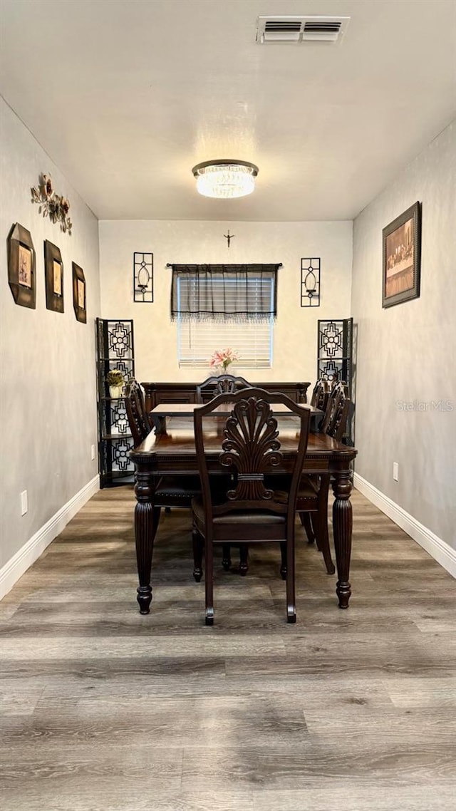 2813 W Kenmore Ave, Tampa, FL 33614 - dining room with wood finished floors and baseboards