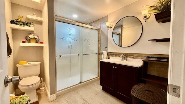 2813 W Kenmore Ave, Tampa, FL 33614 - bathroom with a stall shower, vanity, and wood finished floors
