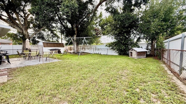 2813 W Kenmore Ave, Tampa, FL 33614 - fenced backyard with a storage unit and a patio area