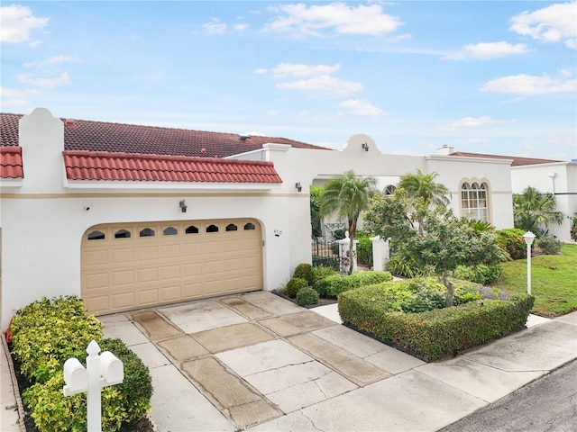 4719 61st Avenue Terrace W Unit 4719, Bradenton, FL 34210 - mediterranean / spanish-style house with a tile roof, stucco siding, concrete driveway, and an attached garage