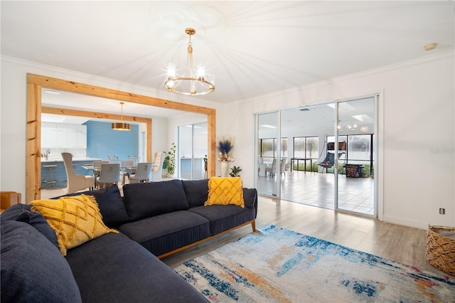4719 61st Avenue Terrace W Unit 4719, Bradenton, FL 34210 - living room featuring a chandelier, wood finished floors, and crown molding