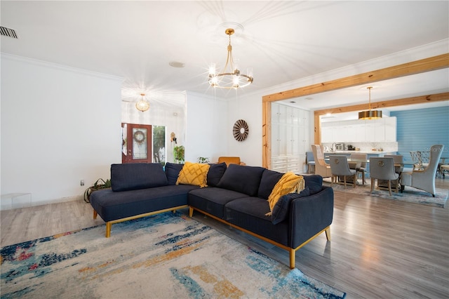 4719 61st Avenue Terrace W Unit 4719, Bradenton, FL 34210 - living area with a chandelier, wood finished floors, and ornamental molding
