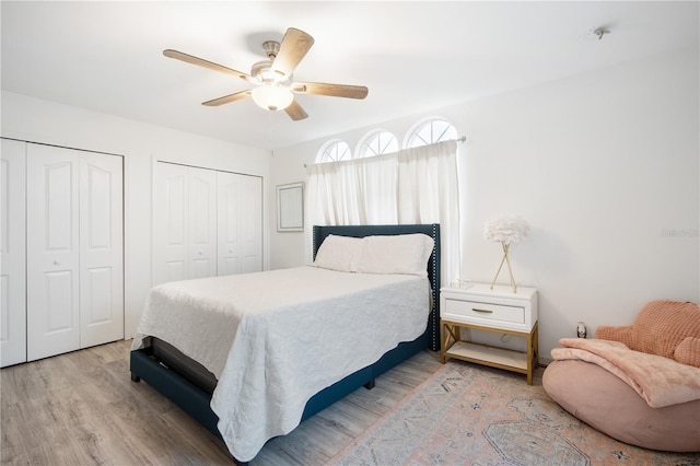 4719 61st Avenue Terrace W Unit 4719, Bradenton, FL 34210 - bedroom with two closets, wood finished floors, and a ceiling fan