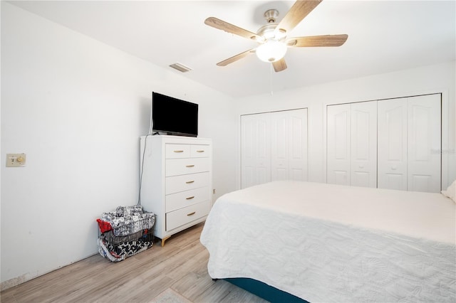 4719 61st Avenue Terrace W Unit 4719, Bradenton, FL 34210 - bedroom with multiple closets, light wood-type flooring, and a ceiling fan
