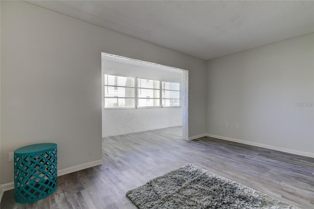 4901 Onyx Ln Unit 204, New Port Richey, FL 34652 - unfurnished room with wood finished floors and baseboards