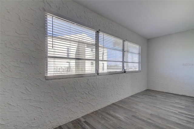 4901 Onyx Ln Unit 204, New Port Richey, FL 34652 - empty room featuring a textured wall and wood finished floors