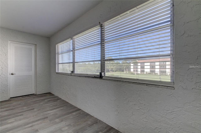 4901 Onyx Ln Unit 204, New Port Richey, FL 34652 - empty room with a textured wall and wood finished floors