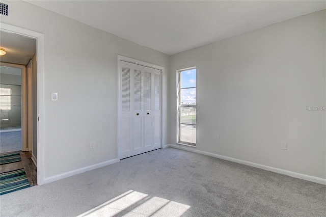 4901 Onyx Ln Unit 204, New Port Richey, FL 34652 - unfurnished bedroom with carpet and a closet