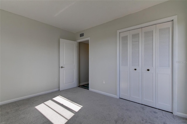 4901 Onyx Ln Unit 204, New Port Richey, FL 34652 - unfurnished bedroom featuring carpet floors and a closet