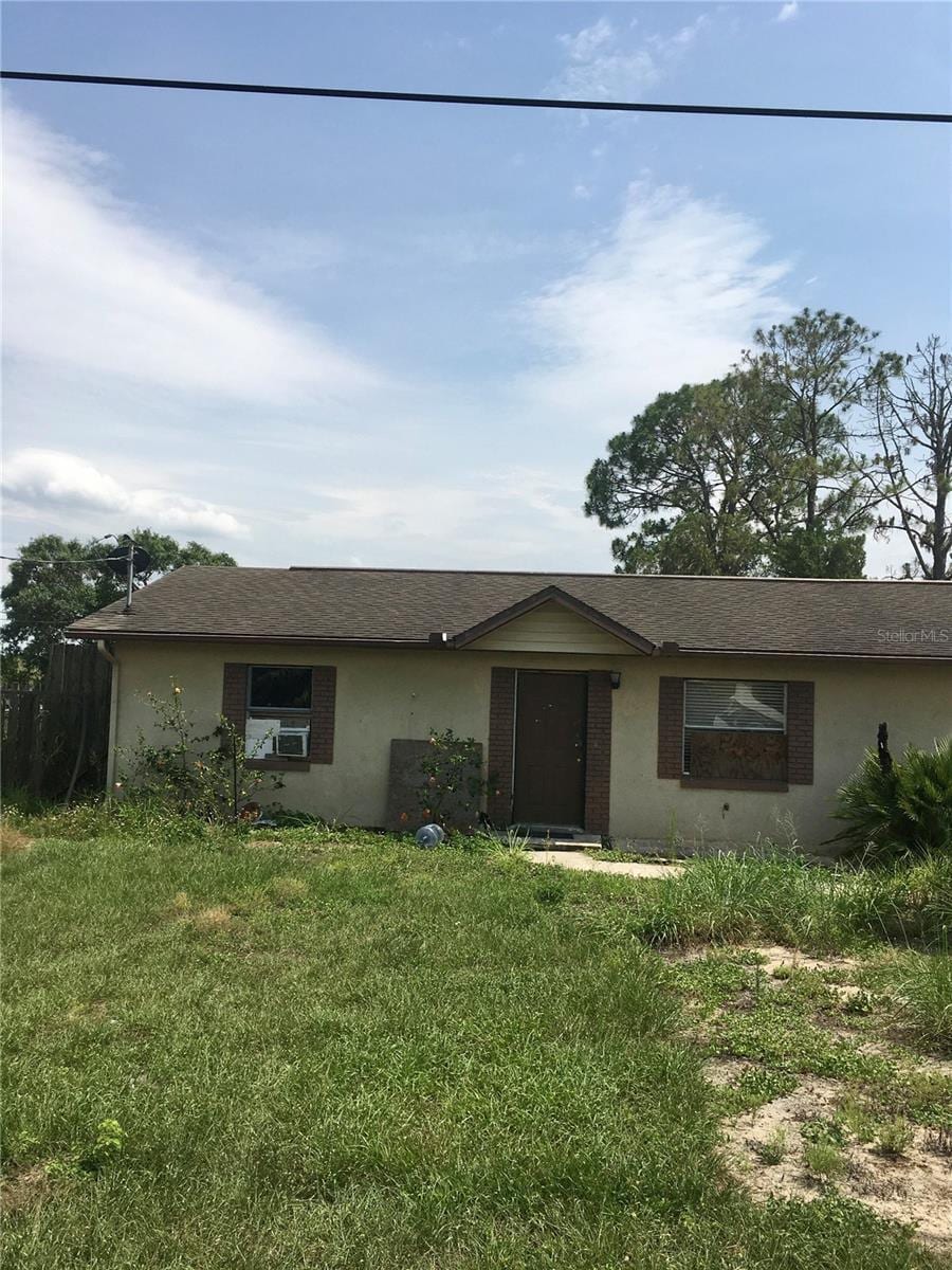 2532 Elm Ave, Lake Wales, FL 33898 - ranch-style home featuring a front lawn and stucco siding