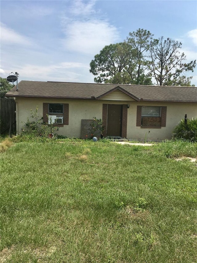 2532 Elm Ave, Lake Wales, FL 33898 - ranch-style home with a front yard and stucco siding