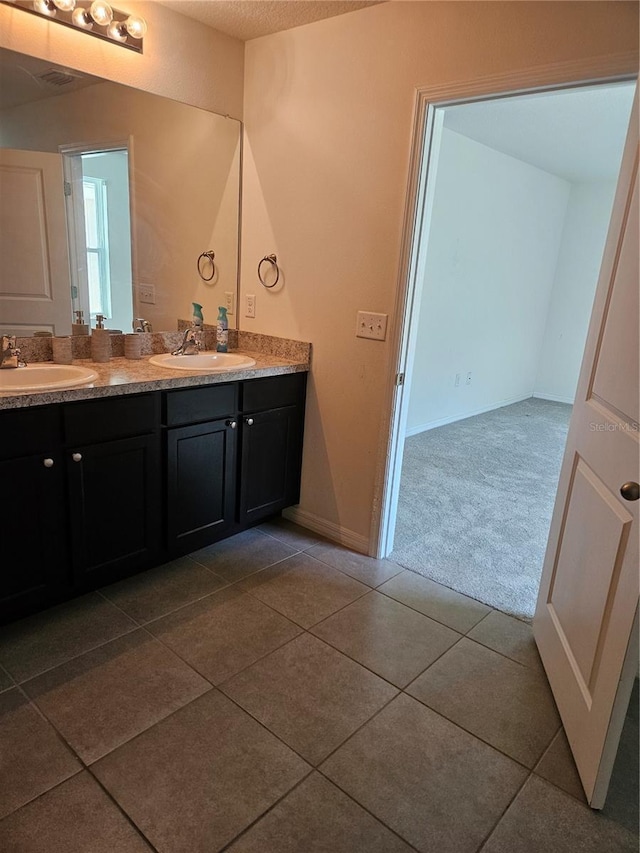 10124 Mangrove Well Rd, Ruskin, FL 33573 - bathroom featuring double vanity and tile patterned flooring