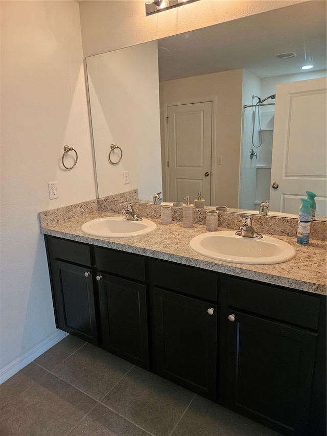 10124 Mangrove Well Rd, Ruskin, FL 33573 - bathroom with double vanity, tile patterned flooring, and a shower