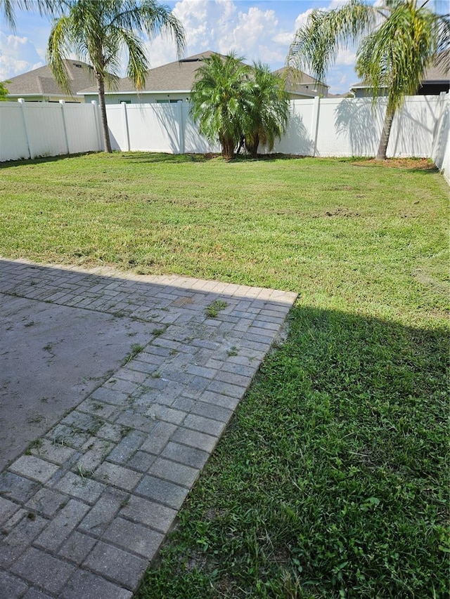 10124 Mangrove Well Rd, Ruskin, FL 33573 - fenced backyard featuring a patio area