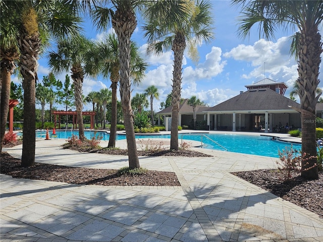 10124 Mangrove Well Rd, Ruskin, FL 33573 - community pool featuring a pergola and a patio