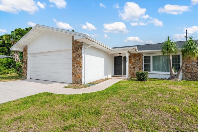 1720 Patlin Cir N, Largo, FL 33770 - ranch-style house featuring stone siding, an attached garage, concrete driveway, and a front yard