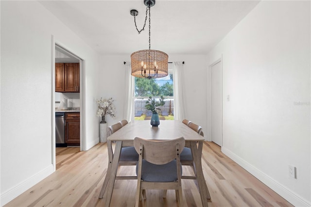1720 Patlin Cir N, Largo, FL 33770 - dining space featuring light wood-style floors and a chandelier