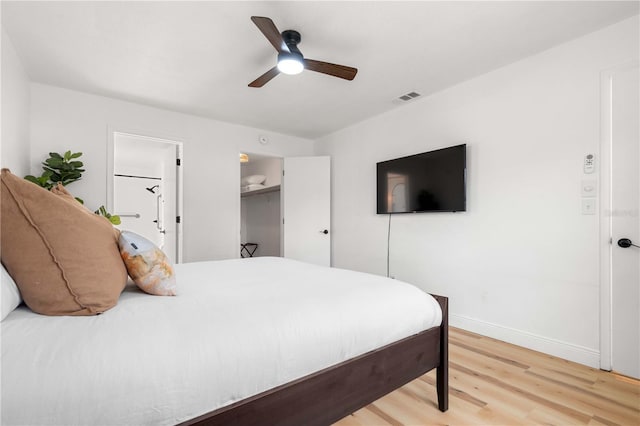 1720 Patlin Cir N, Largo, FL 33770 - bedroom with light wood-type flooring and a ceiling fan