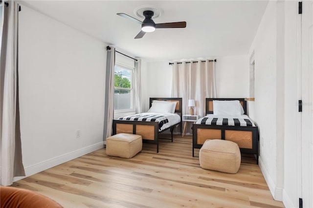 1720 Patlin Cir N, Largo, FL 33770 - bedroom featuring wood finished floors and a ceiling fan