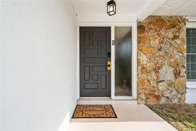 1720 Patlin Cir N, Largo, FL 33770 - view of exterior entry with stone siding and stucco siding