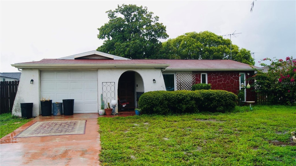 7705 Embassy Blvd, Port Richey, FL 34668 - ranch-style home with stucco siding