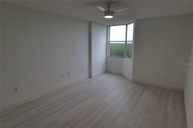 2333 Feather Sound Dr Unit A607, Clearwater, FL 33762 - empty room with ceiling fan, light wood-style flooring, and a textured ceiling