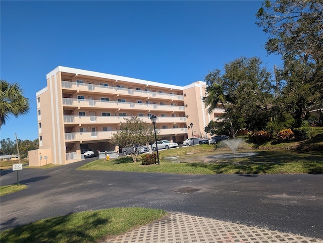9510 Harbor Greens Way Unit 406, Seminole, FL 33776 - view of apartment building / complex