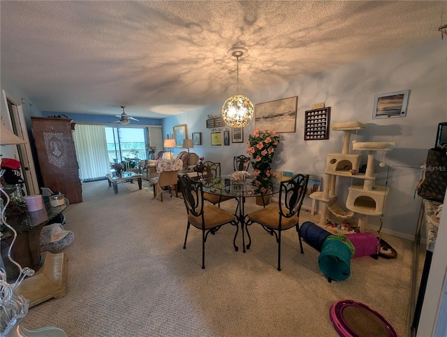 9510 Harbor Greens Way Unit 406, Seminole, FL 33776 - carpeted dining room with a textured ceiling, a chandelier, and a ceiling fan