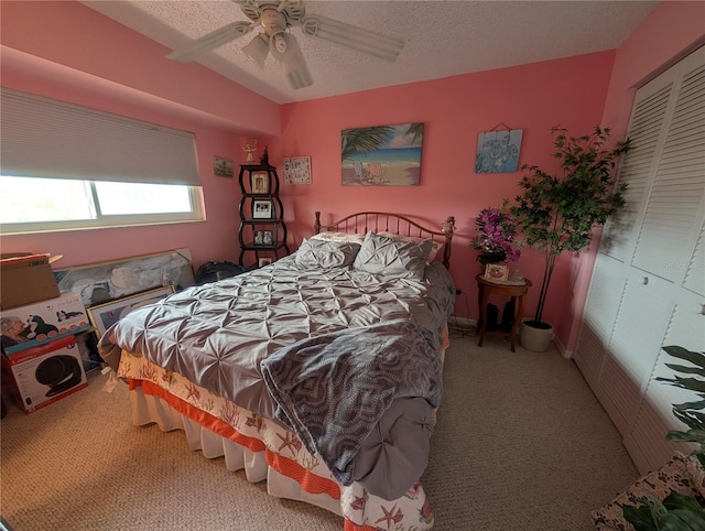 9510 Harbor Greens Way Unit 406, Seminole, FL 33776 - bedroom with carpet flooring, a closet, a ceiling fan, and a textured ceiling