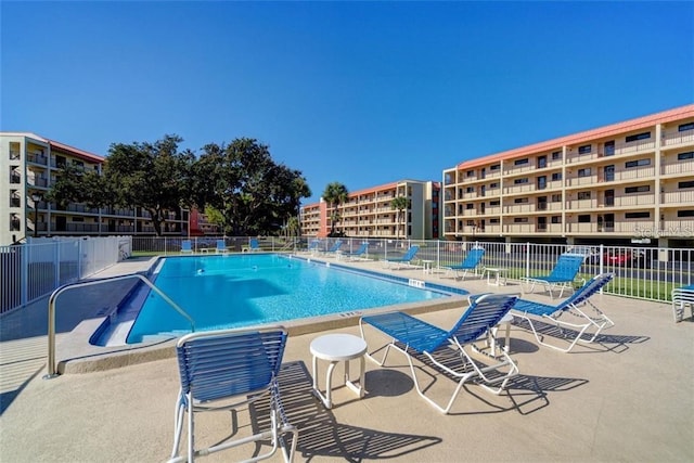 9510 Harbor Greens Way Unit 406, Seminole, FL 33776 - community pool featuring a patio area