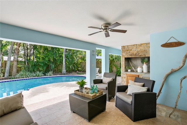 221 42nd Ave, St Pete Beach, FL 33706 - swimming pool featuring ceiling fan, an outdoor living space, a patio, and a fenced backyard